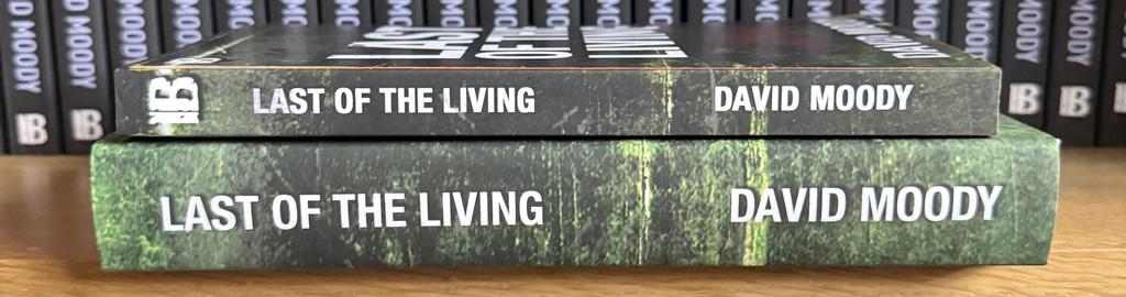 Two editions of David Moody's Last of the Living - the 2014 original paperback on top of the 2025 expanded hardcover.